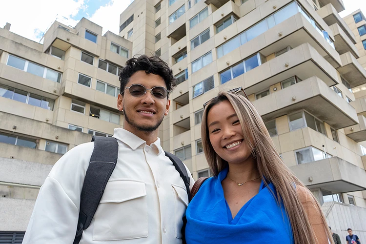 Couple standing in front of a building